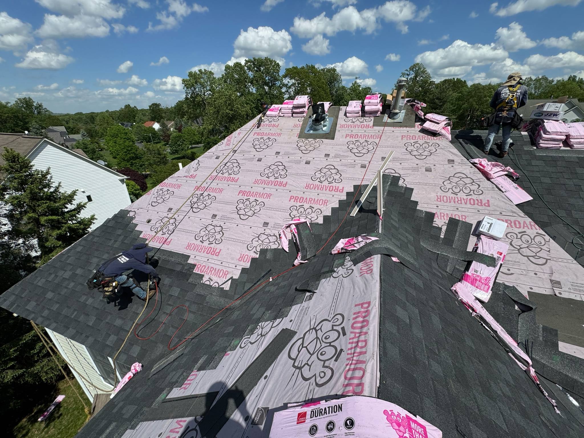 Roofers Near Me Virginia installing asphalt shingles