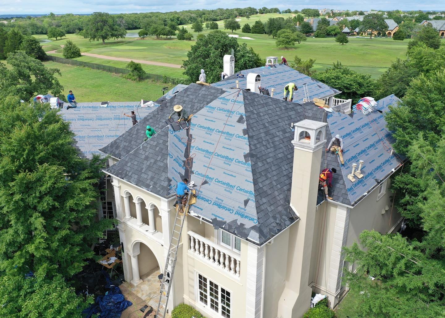 Homeowner reviewing free roofing estimates from Virginia contractors